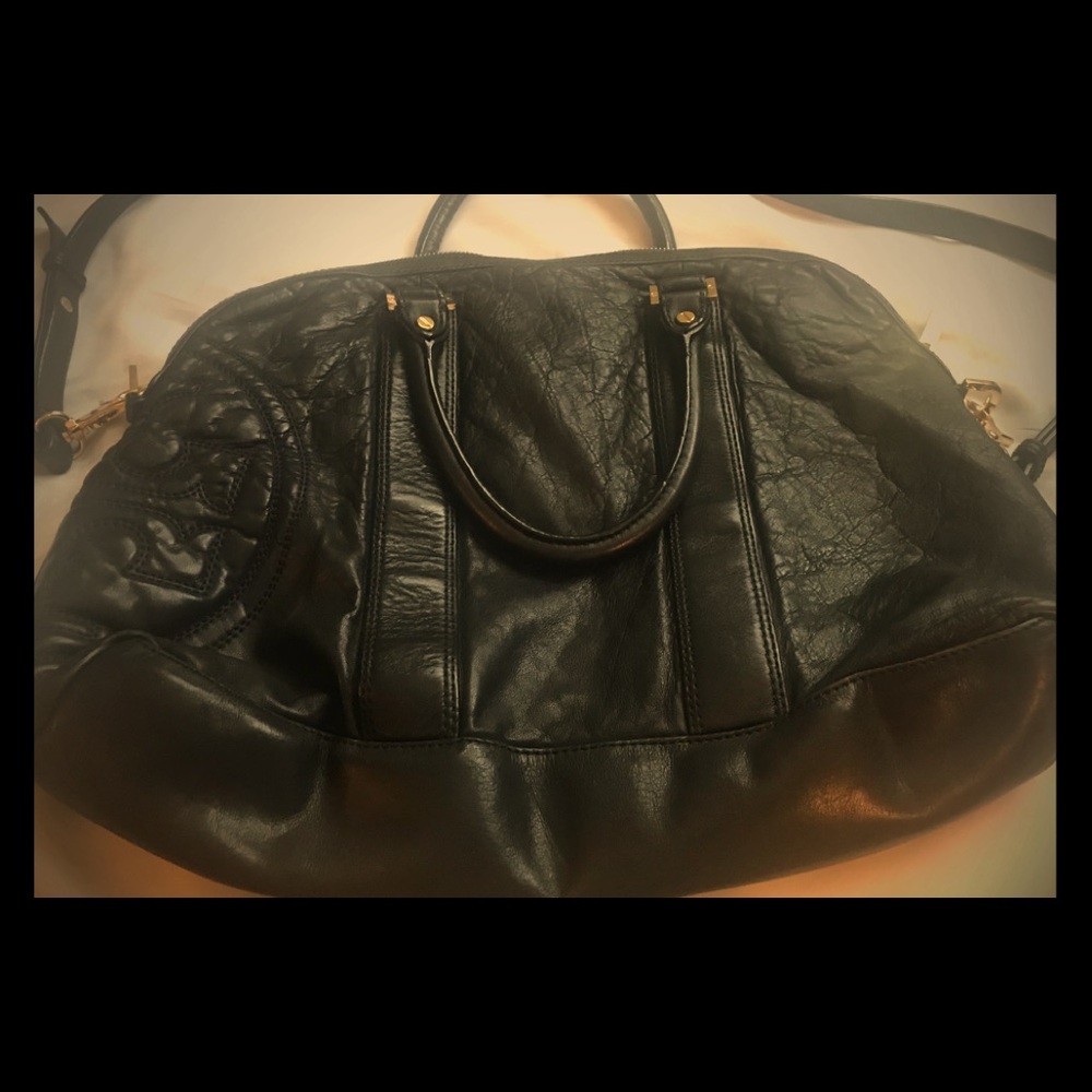 The brand Tory Burch black leather satchel